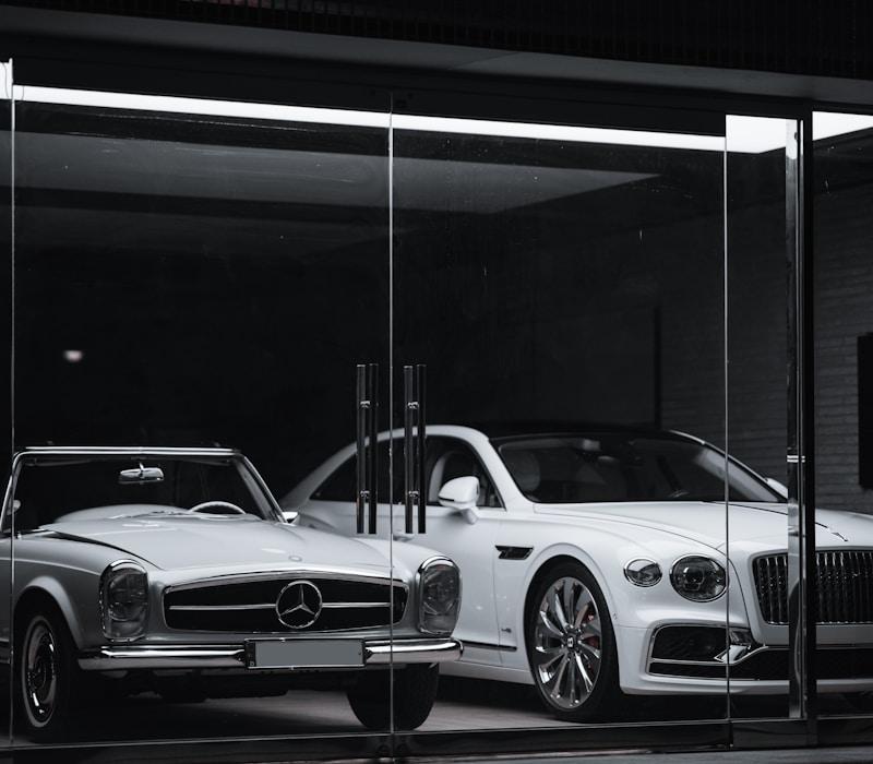 White Mercedes in dark showroom